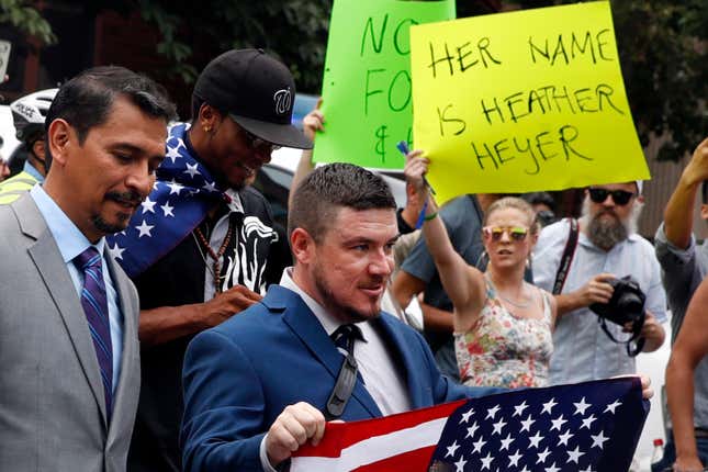 White nationalist Jason Kessler, center, walks to the White House to rally on the one year anniversary of the Charlottesville “Unite the Right” rally on Aug. 12, 2018, in Washington. A jury ordered white nationalist leaders and organizations to pay more than $25 million in damages Tuesday, Nov. 23, 2021, over violence that erupted during the deadly 2017 Unite the Right rally in Charlottesville. The lawsuit accused some of the country’s most well-known white nationalists of plotting the violence, including Jason Kessler, the rally’s main organizer; Richard Spencer, who coined the term “alt-right” to describe a loosely connected band of white nationalists, neo-Nazis and others; and Christopher Cantwell, a white supremacist who became known as the “crying Nazi” for posting a tearful video when a warrant was issued for his arrest on assault charges for using pepper spray against counterdemonstrators. 