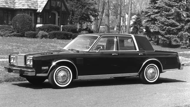 A black and white photo of a Chrysler New Yorker. 