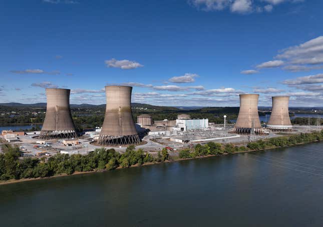 four nuclear power reactors on a piece of land with part of the river in the foreground