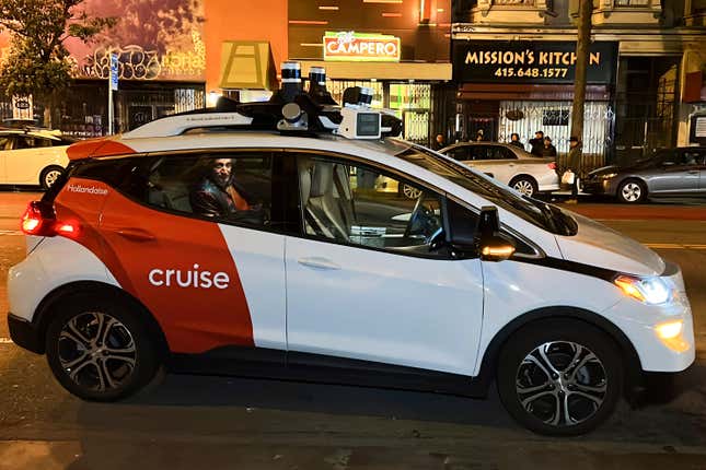 FILE - Associated Press reporter Michael Liedtke sits in the back of a Cruise driverless taxi that picked him up in San Francisco&#39;s Mission District, Feb. 15, 2023. General Motors&#39; troubled robotaxi service Cruise on Tuesday, Feb. 6, 2024, endured a public lashing from a California judge who compared the company to the devious TV character Eddie Haskell for its behavior following a ghastly collision that wrecked its ambitious expansion plans. (AP Photo/Terry Chea, File)