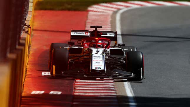 A photo of the front end on the red and white Alfa Romeo F1 car. 