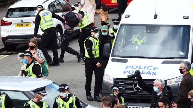 Image for article titled Hero Protestor Laid Under Immigration Van For Eight Hours To Stop Raid