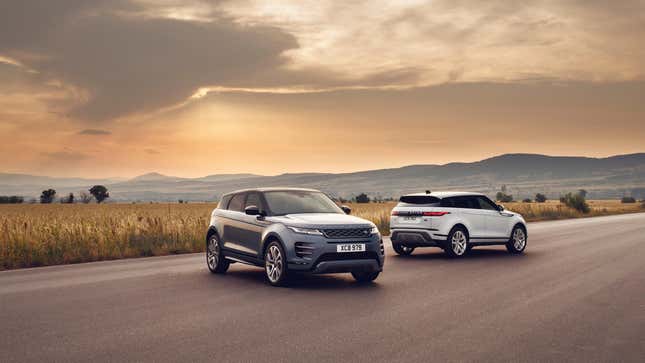 Two Land Rover Evoques parked in front of a sunset