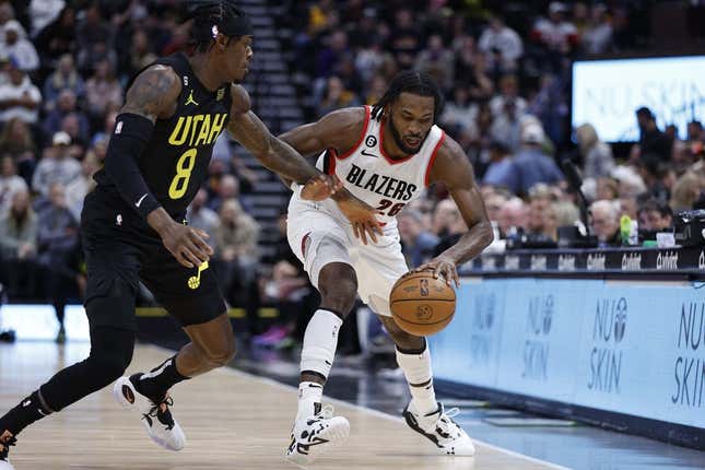 Dec 3, 2022; Salt Lake City, Utah, USA; Utah Jazz forward Jarred Vanderbilt (8) and Portland Trail Blazers forward Justise Winslow (26) battle on in the first quarter at Vivint Arena.