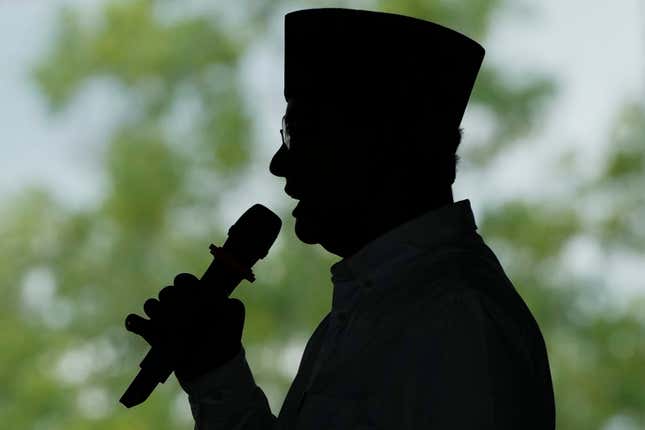 Presidential candidate Anies Baswedan is silhouetted as he speaks during a campaign rally in Lampung Timur, Indonesia, Sunday, Jan. 14, 2024. The former Jakarta governor seeking Indonesia&#39;s presidency said democracy is declining in the country and pledged to make changes to get it back on track. (AP Photo/Achmad Ibrahim)