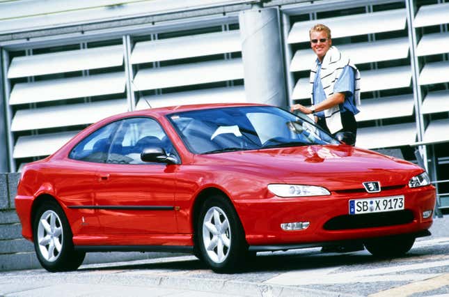 Front 3/4 view of a red Peugeot 406 coupe