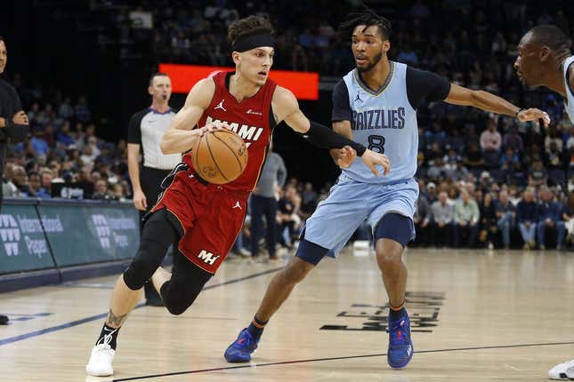 Nov 8, 2023; Memphis, Tennessee, USA; Miami Heat guard Tyler Herro (14) drives to the basket as Memphis Grizzlies forward Ziaire Williams (8) defends during the first half at FedExForum.