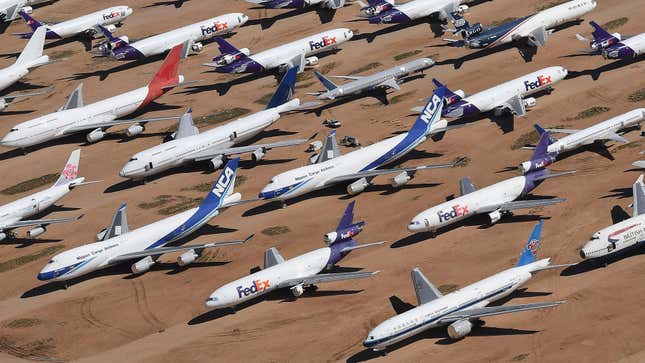 This photo taken on March 28, 2019 shows planes from various airlines in storage at a 'Boneyard' facility beside the Southern California Logistics Airport in Victorville, California.