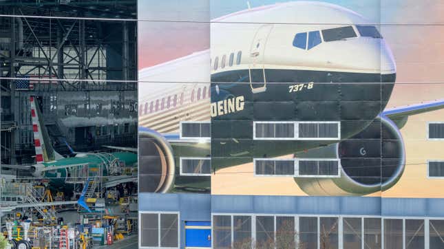 A mural of the Boeing 737 Max 8 on the door a Boeing factory in Renton, Washington, with the door ajar and production activity visible inside