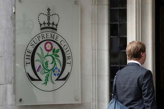 FILE - A man enters the Supreme Court in London, on Oct. 9, 2023. An artificial intelligence system can&#39;t be registered as the inventor of a patent, Britain&#39;s Supreme Court ruled on Wednesday Dec. 20, 2023 in a decision denying machines the same status as humans. (AP Photo/Kin Cheung, File)