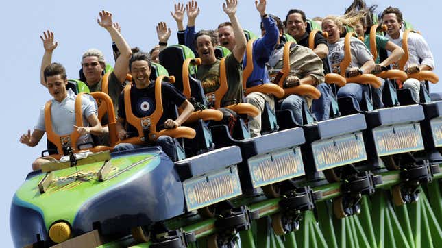 The riders raise their arms as they ride the "Kingda Ka" roller coaster on May 19, 2005, at Six Flags amusement park in Jackson, New Jersey.