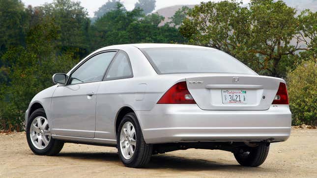 A photo of the rear quarter on a silver Honda Civic coupe. 