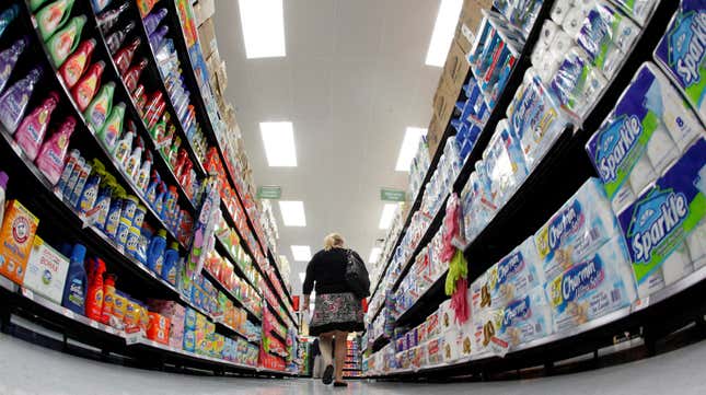 A customer shops the aisle of a Walmart store.