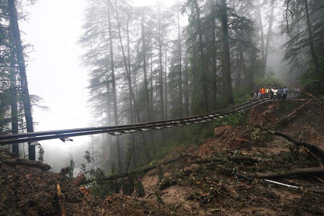 FILE - A portion of the Shimla-Kalka heritage railway track that got washed away following heavy rainfall on the outskirts of Shimla, Himachal Pradesh state, Monday, Aug.14, 2023. This year’s COP28 in Dubai is likely to see more discussion about compensation for developing nations harmed by climate change. (AP Photo/Pradeep Kumar, File)