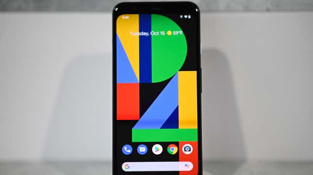 A pixel 4 phone on a stand showing the normal destop icons and a large P4 on the screen.