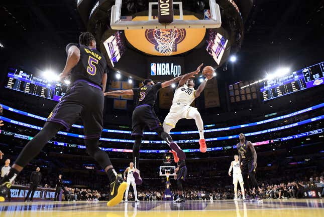 LOS ANGELES, CALIFORNIA - NOVEMBER 21: Ochai Agbaji #30 of the Utah Jazz goes up for a layup against Anthony Davis #3 of the Los Angeles Lakers during the first half of an NBA In-Season Tournament game at Crypto.com Arena on November 21, 2023 in Los Angeles, California. NOTE TO USER: User expressly acknowledges and agrees that, by downloading and or using this photograph, User is consenting to the terms and conditions of the Getty Images License Agreement. (Photo by Kevork Djansezian/Getty Images)