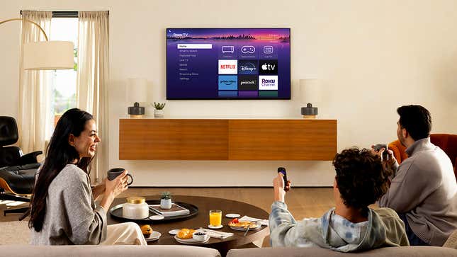 A photo of a family around a new Roku Pro TV 
