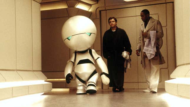 marvin and humans walking down a hall way.