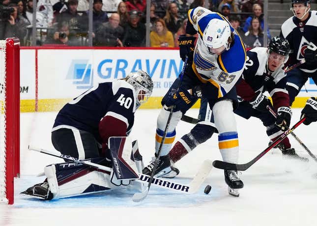 Nov 11, 2023; Denver, Colorado, USA; Colorado Avalanche goaltender Alexandar Georgiev (40) makes a save on St. Louis Blues left wing Jake Neighbours (63) in the first period at Ball Arena.
