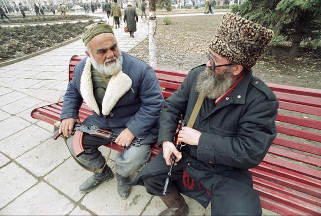 Elderly Chechen volunteers rest during a rally in Grozny on Dec. 1, 1994.