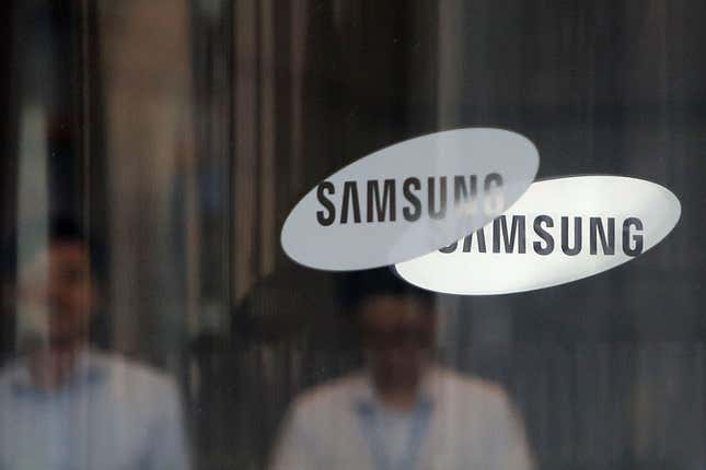 Two Samsung logos displayed on a window of Samsung office in Seoul