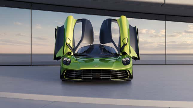 Front view of a green Aston Martin Valhalla with the doors open