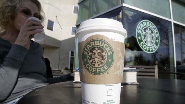 Customer drinking what could be her second cup of Starbucks coffee if she owned a Verismo.