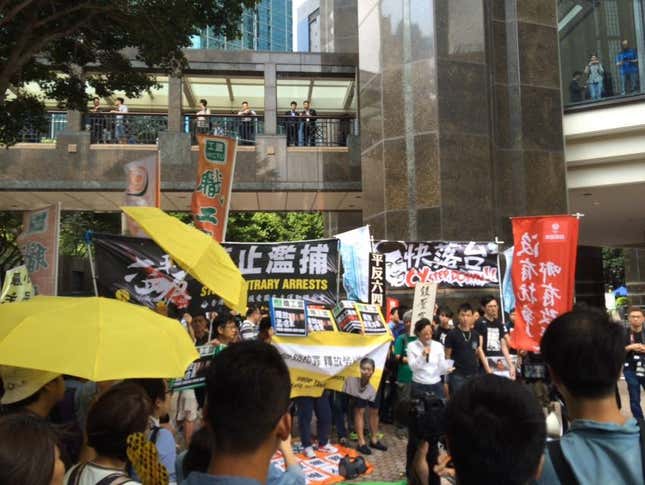Pro-democracy protestors carry yellow umbrellas and posters calling for the resignation of CY Leung, Hong Kong’s chief executive.