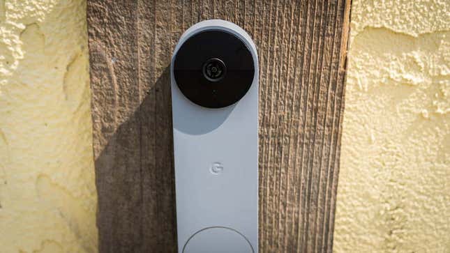 A photo of the battery-powered doorbell affixed to a plank of wood