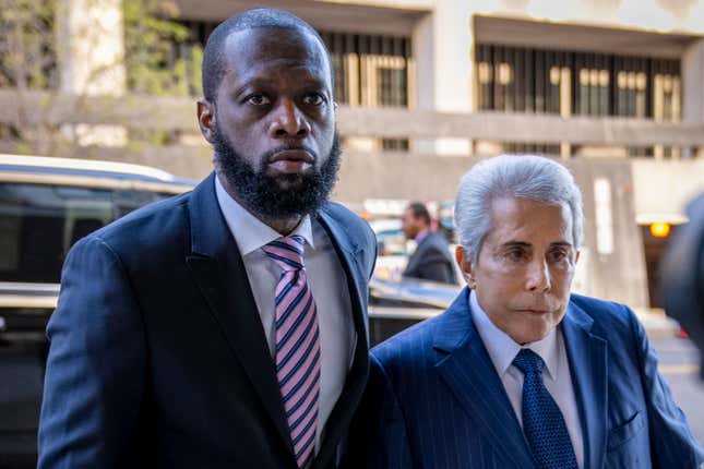 FILE - Prakazrel &quot;Pras&quot; Michel, left, a member of the 1990s hip-hop group the Fugees, accompanied by defense lawyer David Kenner, right, arrives at federal court for his trial March 30, 2023, in Washington. Michel argued this week that use of the generative AI program was one of a number of errors his previous attorney made a trial for which he was &quot;unqualified, unprepared and ineffectual,&quot; according to a motion for new trial his new lawyers filed. (AP Photo/Andrew Harnik, File)