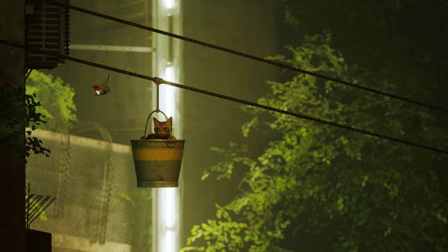 A cat rides in a bucket in Stray.