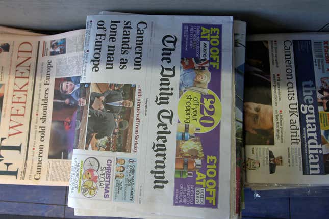 FILE - British national newspapers are seen for sale at a newspapers vendor in Wimbledon, south London, Saturday, Dec. 10, 2011. The U.K. government said Wednesday, March 13, 2024, it will back legislation banning foreign state ownership of British newspapers and magazines, a move that could upend a planned takeover by a United Arab Emirates-led consortium of the Telegraph Media Group. (AP Photo/Sang Tan, File)