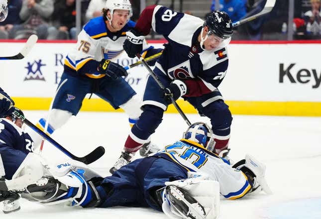 Nov 1, 2023; Denver, Colorado, USA; St. Louis Blues goaltender Jordan Binnington (50) makes a save on Colorado Avalanche center Ross Colton (20) in the second period at Ball Arena.