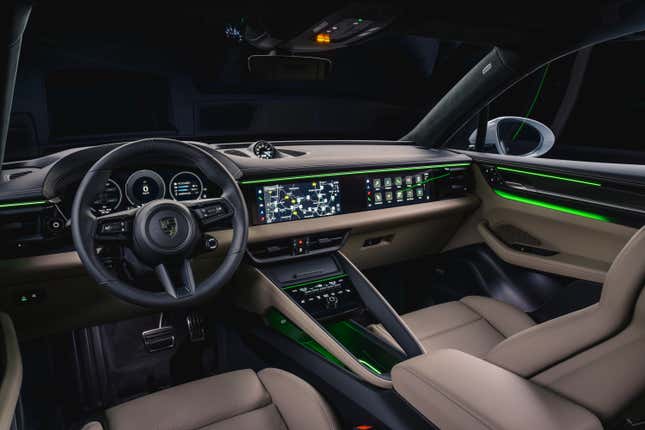 Interior view of a 2024 Porsche Macan EV with beige leather
