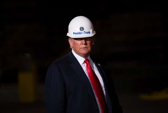 President Donald Trump wears a hard hat as he tours U.S. Steel’s Granite City Works steel mill in Granite City, Illinois in 2018.