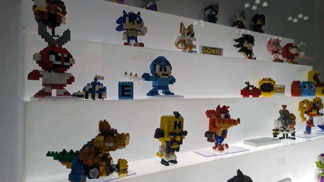 Various video game characters sit on display.