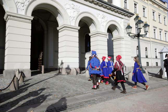 Seven activists representing the Sami Indigenous people arrive at the Royal Castle in Oslo for a meeting with Norway&#39;s King Harald and Crown Prince Haakon, in Oslo, Monday, Oct. 16, 2023. Seven of the activists who repeatedly have demonstrated against a wind farm in in central Norway they say hinders the rights of the Sami Indigenous people to raise reindeer, were Monday received by the Norwegian king. At the center of the dispute are the 151 turbines of Europe’s largest onshore wind farm. (Gorm Kallestad/NTB Scanpix via AP)