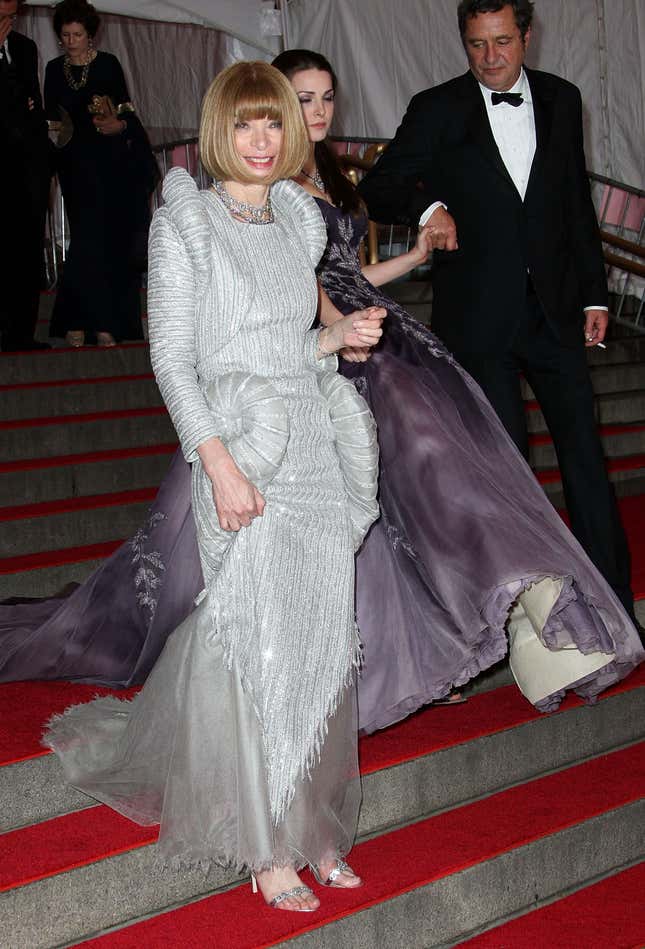 Even Anna Wintour can’t help smiling, all dressed up the “Superheroes” Met Gala.