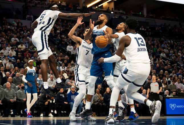 Rudy Gobert of the Minnesota Timberwolves is fouled driving to the basket in the first quarter against the Memphis Grizzlies at Target Center on February 28, 2024 in Minneapolis, Minnesota. 