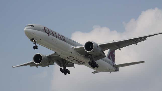 A photo of a Qatar Airways plane flying. 