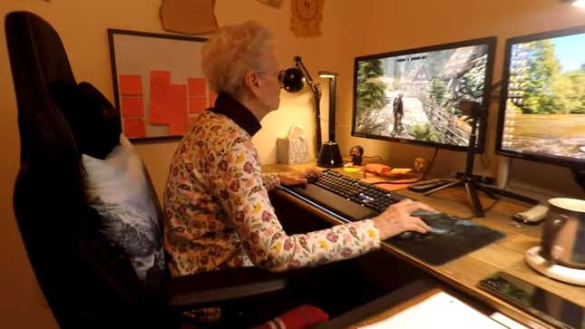 Shirley Curry plays Skyrim at her desk, in her cushioned gamer chair.