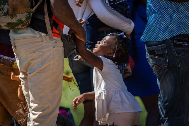 Haitian migrants prepare to cross the Rio Grande from Mexico to Del Rio, Texas on September 23, 2021 in Ciudad Acuna, Mexico. Mexican police surrounded a small migrant camp on the Mexican side of the river, and immigration officials asked migrants to relocate to a shelter further away from the border.