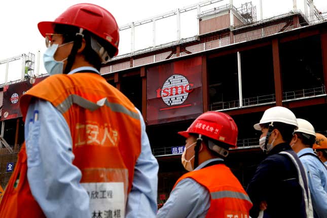 Workers are seen as taiwanese chip giant TSMC holds a ceremony to start mass production of its most advanced 3-nanometer chips in the southern city of Tainan, Taiwan December 29, 2022. 