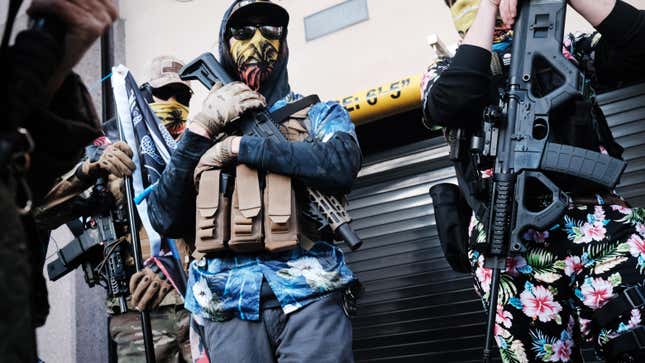 Gun activists identified as "Boogaloo bois" at a heavily armed pro-gun demonstration outside the State House in Richmond, Virginia, in January 2021.