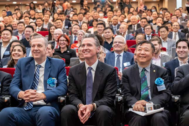 Visiting California Gov. Gavin Newsom, center, poses for a group photograph with guests following the fireside chat at the Hong Kong University in Hong Kong, Monday, Oct. 23, 2023. The Governor of California said on Monday his state will always be a partner on climate issues no matter how the U.S. presidential election next year turns out during his week-long trip to China, in an attempt to reinforce his region&#39;s role as a global leader on climate change. (AP Photo/Anthony Kwan)