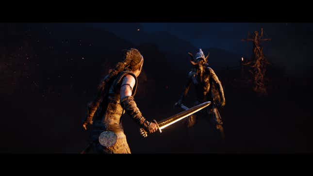 Senua stands at the ready to fight her foe.