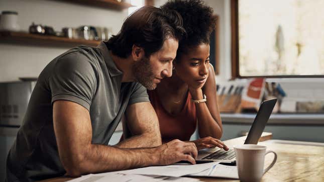 couple looking at a laptop together