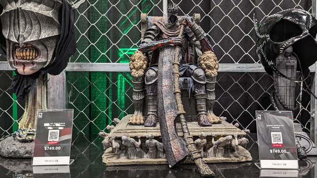 A statue of a Dark Souls III character sits on display.