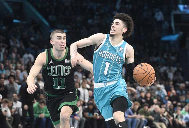 Nov 20, 2023; Charlotte, North Carolina, USA; Charlotte Hornets guard LaMelo Ball (1) drives past Boston Celtics guard Payton Pritchard (11) during the second half at the Spectrum Center.