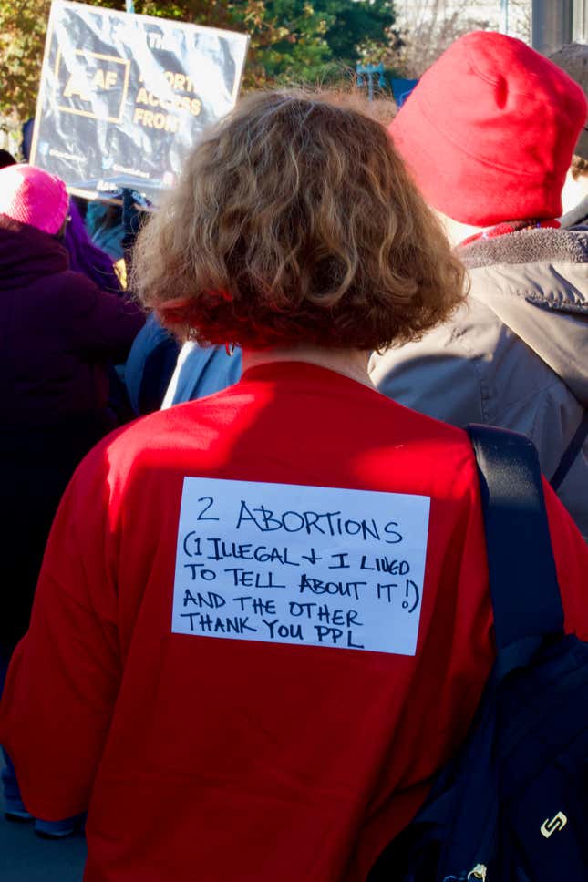 The back of Francine Tansey’s shirt describing her two abortion experiences.